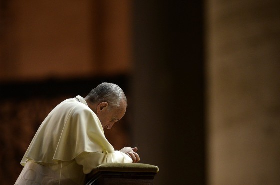 Pope Francis prays in Saint Peter's Square at the Vatican on September 7, 2013.