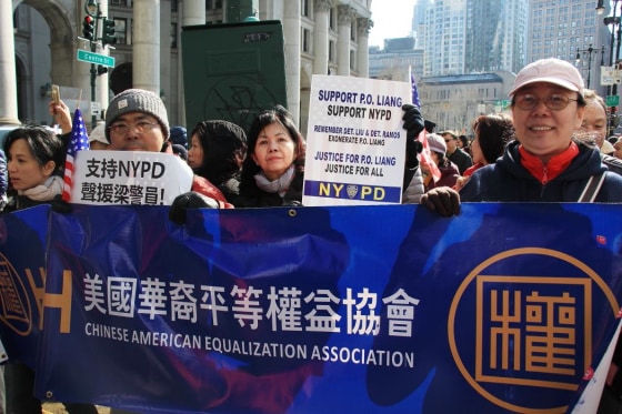 Supporters rally for NYPD Officer Peter Liang, indicted for the Brooklyn shooting of Akai Gurley, an unarmed man.