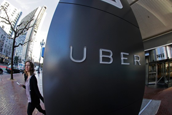 Image: A woman leaves the headquarters of Uber in San Francisco