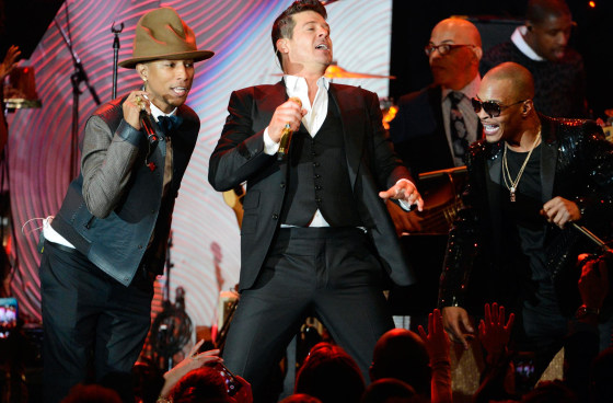 Image: File photo of Pharrell Williams, Robin Thicke and T.I. performing at the Clive Davis Pre-Grammy Gala and Salute to Industry Icons, honoring Universal Music Group Chairman and CEO Lucian Grainge, in Beverly Hills