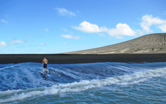 Zandy Sugar steps walks on the shore of a new island created by a volcanic eruption earlier this year. Charter boat owner Branko Sugar told NBC via email that the new land deserved a name and suggested Zandy, after his son, the first person to touch the black volcanic soil. 