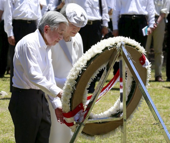 Image: Japan's Emperor Akihito and Empress Michiko lay a wreath to mourn war victims at the cenotaph for the U.S. Army's 81st Infantry Division, on Palau's Peleliu Island