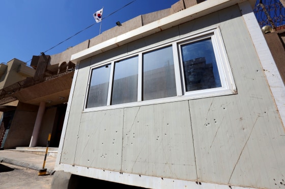 Image: Bullet holes in the guard post in front of the South Korean Embassy in the Libyan capital Tripoli