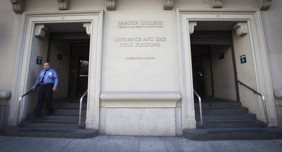 A security personnel walks down a flight of steps at Baruch College in New York December 12, 2013. Police are investigating the death of Chen "Michael" Deng, 19, a freshman at Baruch College in Manhattan, who suffered brain trauma after "too many" tackles during a Pi Delta Psi fraternity hazing incident over the weekend in the Poconos, a prosecutor said on Wednesday.