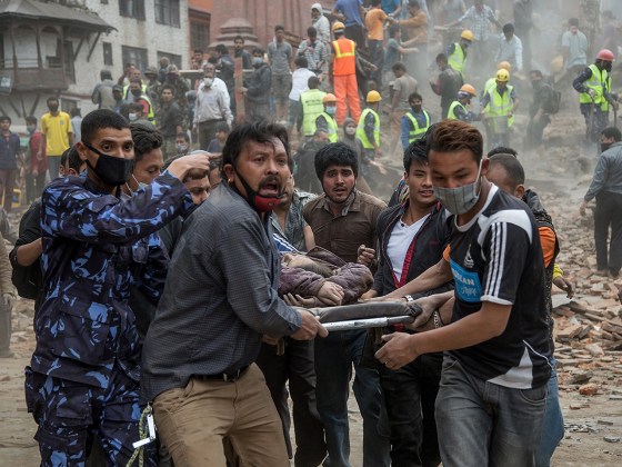  Emergency rescue workers carry a victim on a stretcher after Dharara tower collapsed on April 25, in Kathmandu, Nepal. Hundreds have died as tremors hit Nepal after an earthquake measuring 7.9 on the Richter scale caused buildings to collapse and avalanches to be triggered in the Himalayas.