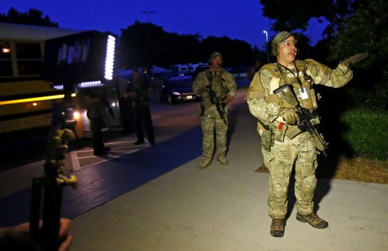 Image: Attendees at the Muhammad Art Exhibit and Contest evacuated after shooting