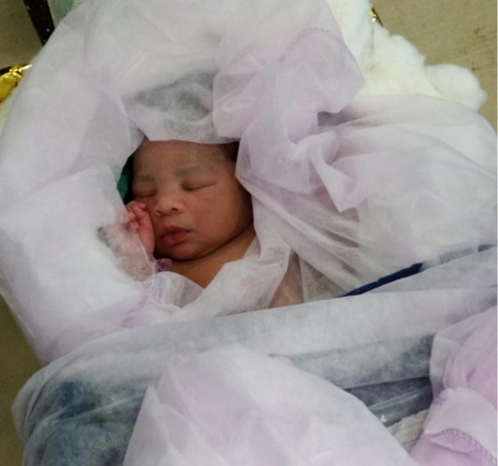A newborn baby sleeps aboard the the Italian Navy ship "Bettica" in an image tweeted by the Italian Navy Ship. The baby was born aboard the ship after its mother, a migrant, was rescued.
