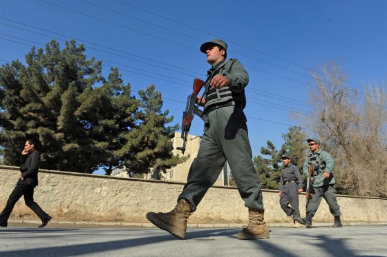 Afghan security forces are pictured near the main gate of the National Directorate of Security in Kabul in 2013.