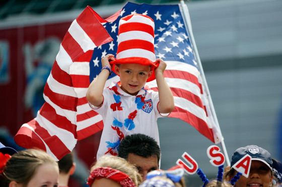 Image: Keegan Bilboa sits atop shoulders outside BC Place stadium before the FIFA Women's World Cup soccer championship
