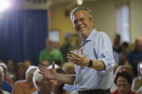 Image: Bush answers a question from the audience during a town hall campaign stop at the VFW Post in Hudson