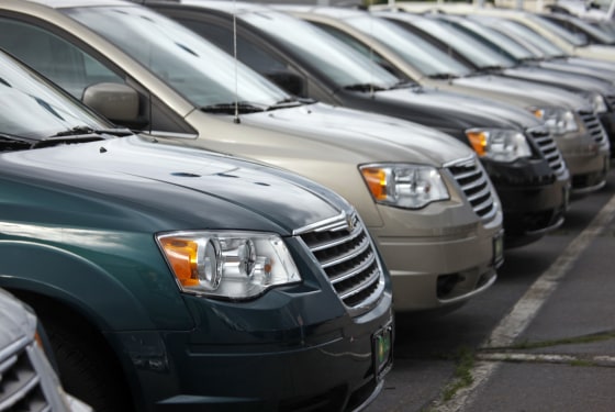 Town & Country minivans sit at a Chrysler-Jeep dealership in the south Denver suburb of Englewood, Colorado, in 2009.
