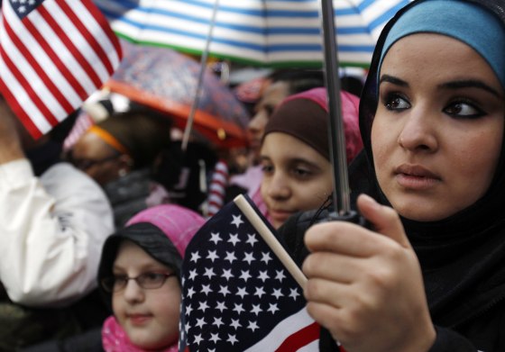 Image: Zienib Noori, 20, of Albany, NY listens to a speaker at the \"Today, I Am A Muslim, Too\" rally in New York City on March 6