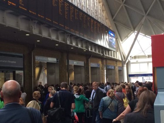 Sea of people stuck at #KingsCross due to a "security incident". Platforms closed and lots of armed police!