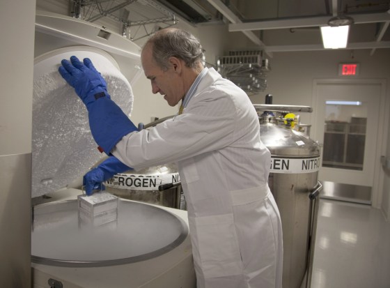 Dr. Carl June, one of the study's leaders, opens a freezer of engineered cells.