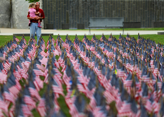 Image: Retired Charlotte Fire Department Capt. Tony Bateman holds his niece