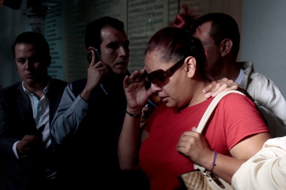 Image: Gabriela Bejarano, sister of Rafael, one of the eight Mexicans killed in an incident in Egypt, leaves the Government Palace after a meeting with local officials in Guadalajara