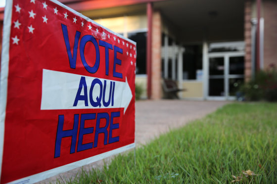 Image: English-Spanish Signs Front Election Center In Texas