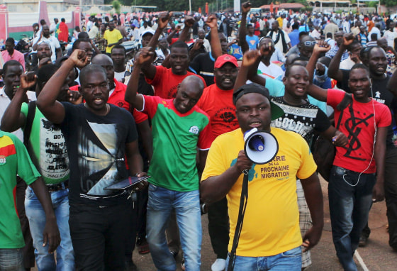 Image: Protesters chant slogans against the presidential guard in Ouagadougou