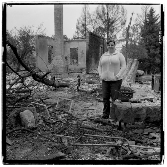 Deanne Hingst stand sin the yard of her parents' home which was lost to the Valley Fire that swept through Middletown on Saturday Sept. 12th. Hingst is stay with friends in Santa Rosa and her parents are at the Valley Evacuation center in Calistoga.