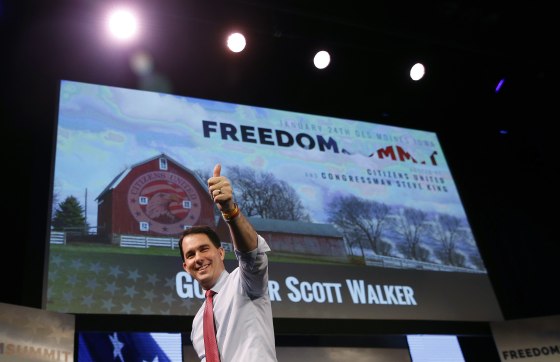 Image: Wisconsin Governor Walker walks off the stage after speaking at the Freedom Summit in Des Moines