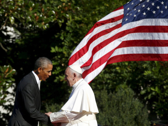 Image: U.S. President Barack Obama shakes hands with Pope Francis during a welcoming ceremony at the White House in Washington