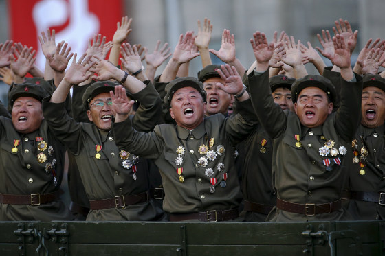 Image: Veteran soldiers react as their truck drives past a stand with North Korean leader Kim Jong Un during the parade celebrating the 70th anniversary of the founding of the ruling Workers' Party of Korea, in Pyongyang