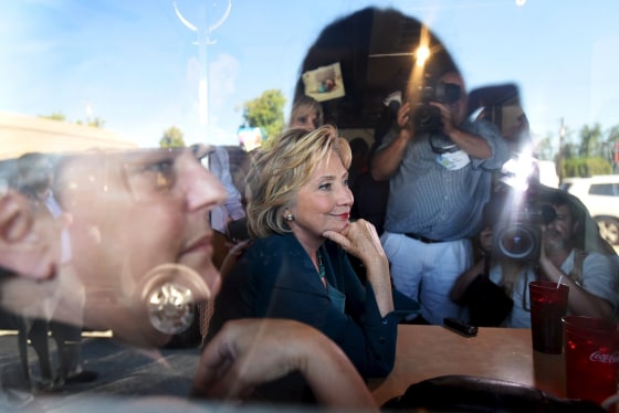 Image: Hillary Clinton sits with diners in Laconia, New Hampshire