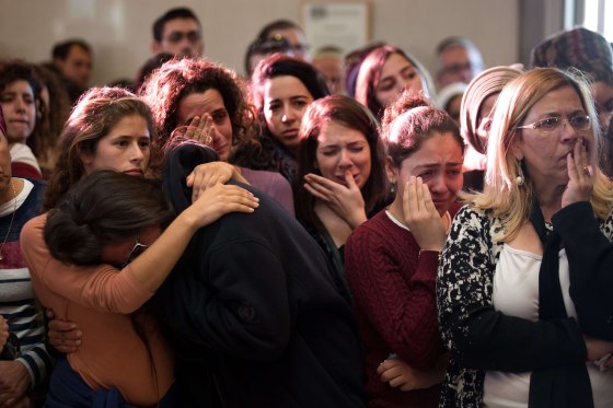 Image: Relatives and friends of Israeli Hadar Buchris mourn