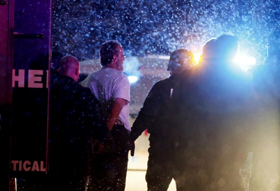 Image: A suspect is taken into custody outside a Planned Parenthood center in Colorado Springs, Colorado