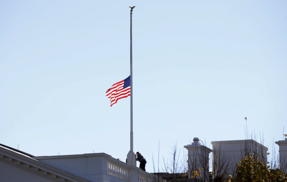 Image: The flag over the White House is lowered to half staff to honor the victims of the San Bernardino, California shootings.