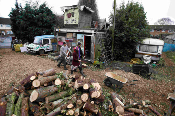 Image: Anti Heathrow expansion activists walk through the 'Grow Heathrow' protest camp