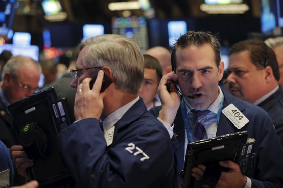 Image: Traders work on the floor of the New York Stock Exchange (NYSE) shortly after the opening bell in New York