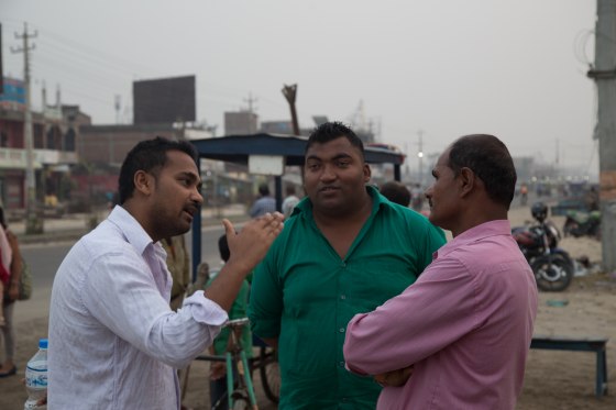 Ravi Kumar speaks with local residents in Janakpur, Nepal. Kumar was born and raised just outside of Janakpur, but left to study in the United States in 2007.