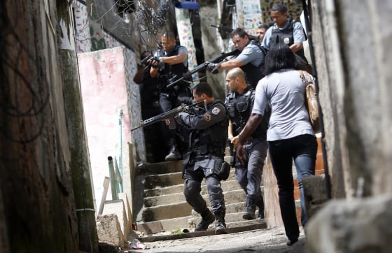 Image: Policemen patrol Rocinha in this 2012 file photo.