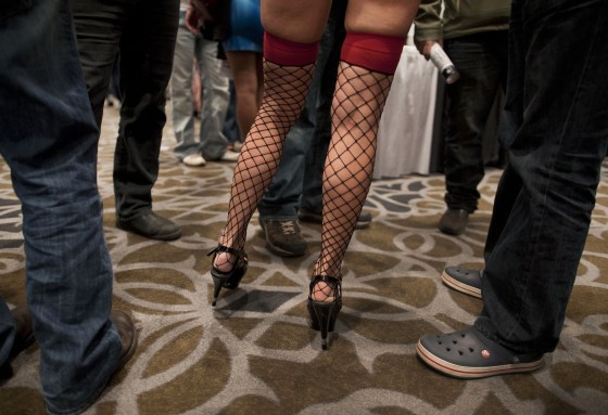 Image: An adult film star stops to talk to fans