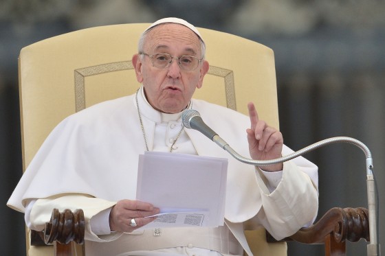 Image: Pope Francis addresses the crowd during his weekly general audience at St Peter's square