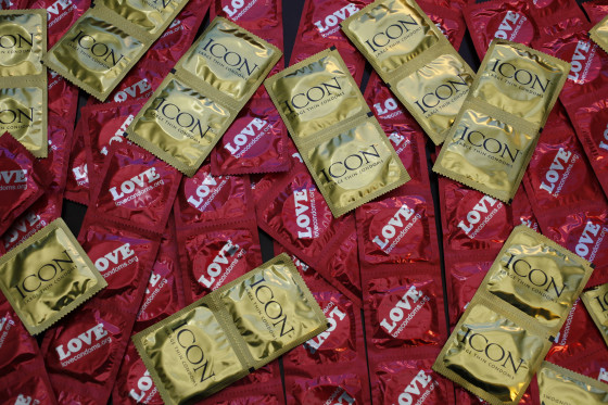 A sample of condoms distributed freely by the AIDS Healthcare Foundation in 28 countries is displayed at a news conference at the AHF headquarters in Los Angeles.