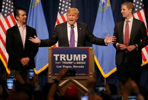Image: Republican U.S. presidential candidate Donald Trump is flanked by his sons Donald Trump Jr. (L) and Eric Trump