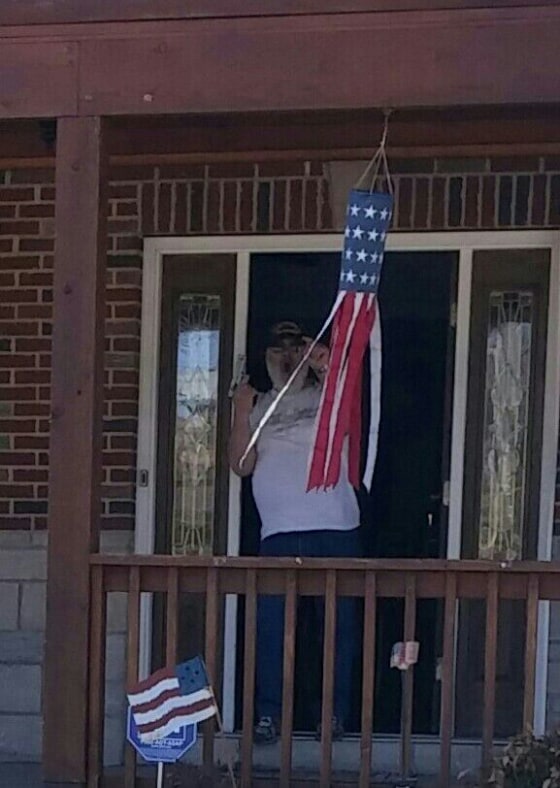 A photo taken by the Ayoub family seemingly showing DeBello holding a hand gun.