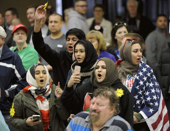 Image: Muslims protest U.S. Republican Presidential candidate Donald Trump during a rally before the Kansas Republican Caucus in Wichita, Kansas