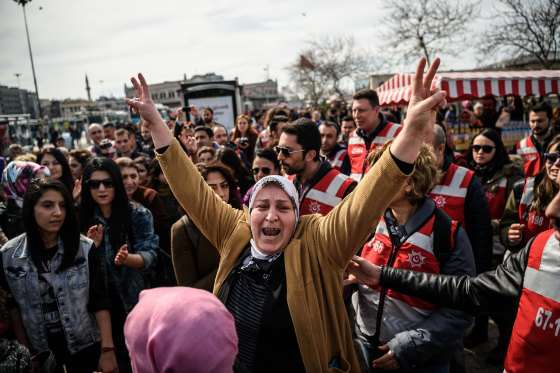 Image: A Turkish woman gives a V sign during a march