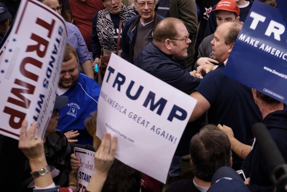 Image: Attendees clash during a Trump rally