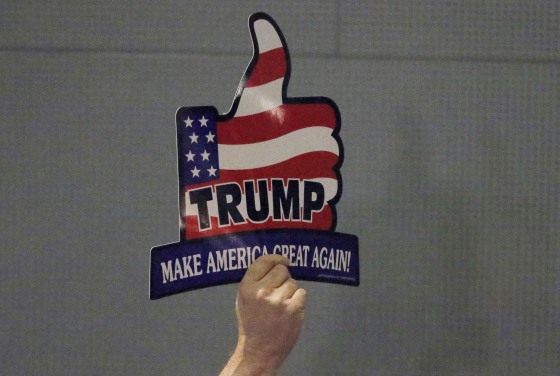 Image: A supporter for U.S. Republican presidential candidate Trump holds sign during campaign event in Hickory, North Carolina