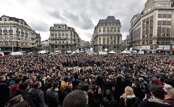 Image: People observe a minute of silence at the Place de la Bourse