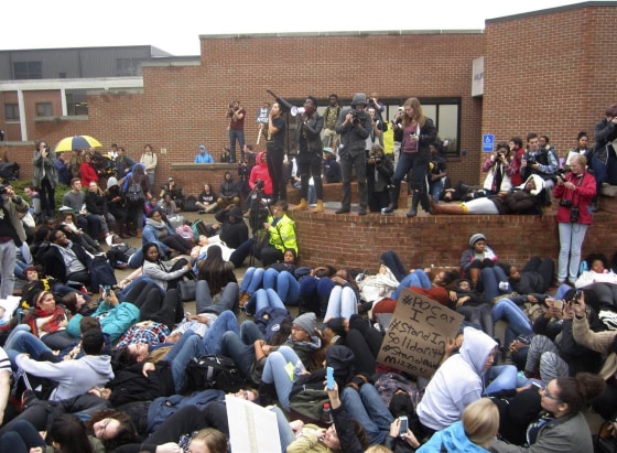 Protesters encourage students to lay down as part of a 'die-in' this afternoon at Ithaca College in New York on Nov. 11.