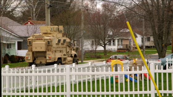 A military surplus armored vehicle, acquired for free by local police departments, tours the streets of Juneau County, Wisconsin.