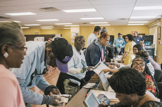 Image: Trina Ashley from Baltimore's Penn North neighborhood checking in to vote