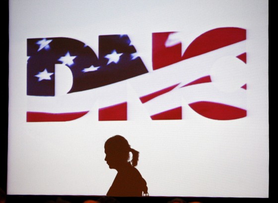 Image: File photo of a woman silhouetted during the DNC Rules and Bylaws Committee meeting in Washington