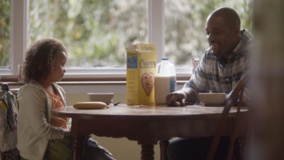 A snapshot of a Cheerios ad featuring a biracial family.