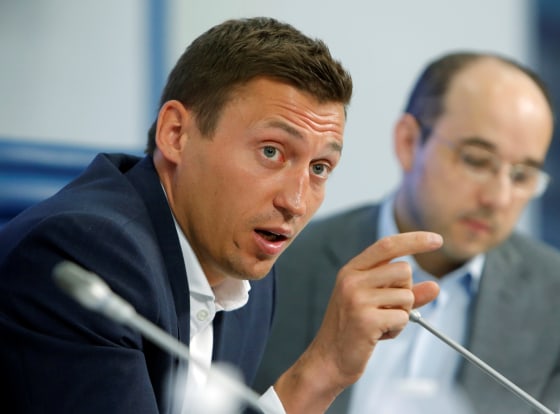 Image: Russian skier Legkov speaks during news conference in Moscow